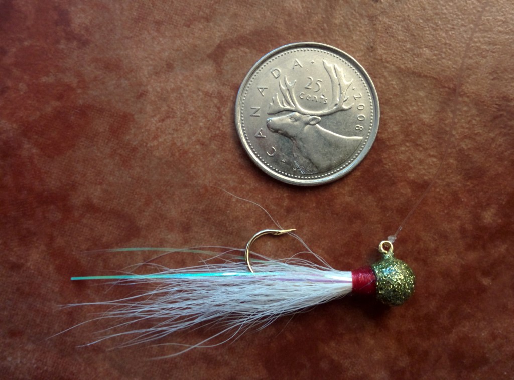 Small white bucktail jig for flounder fishing. home made bucktail jig.